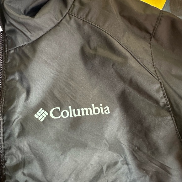 A Columbia rain jacket/wind breaker. It is black w/ a hood. No stains or tears. - Picture 4 of 4